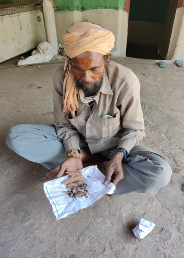 Bhariya ritual healer processing herbal remedies